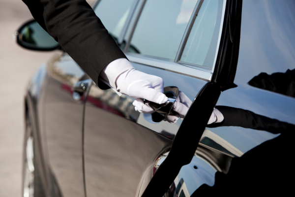 Chauffeur opening the door